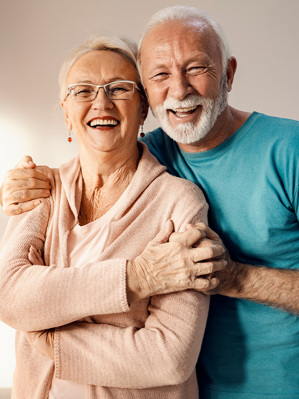 Older gentleman and lady smiling
